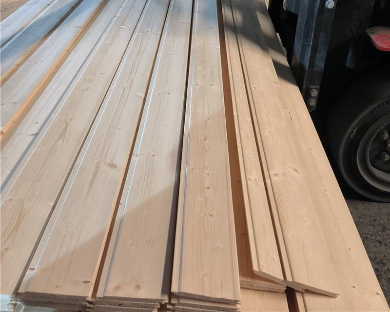 Solid wood moulding profiles in clear-finish grade, showing natural grain surface