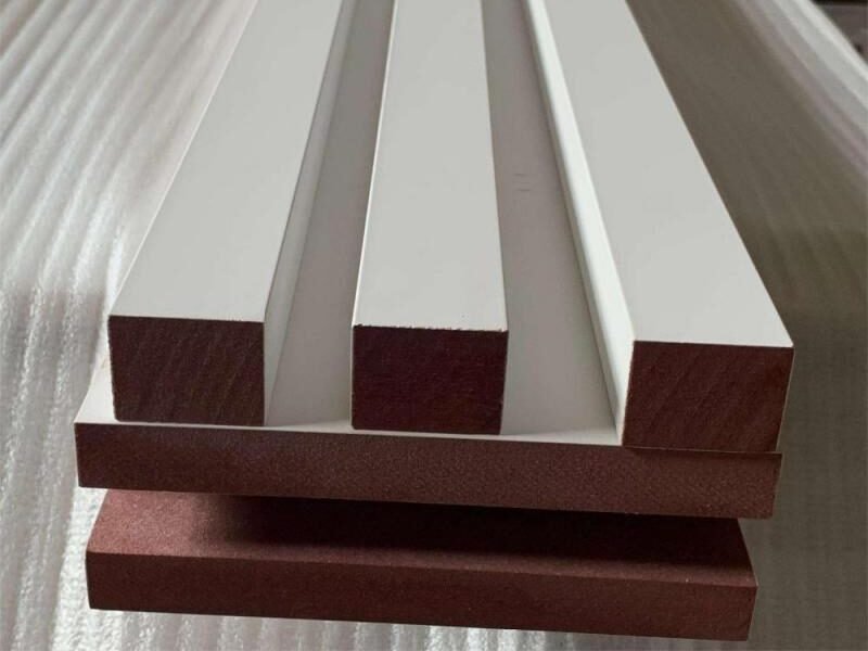 Cross-section of primed MDF moulding profiles showing uniform substrate and clean routed profile