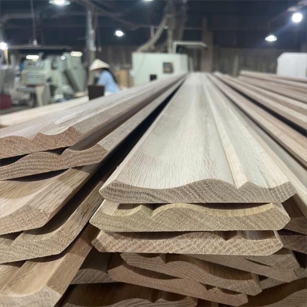 Solid wood moulding profile showing natural grain