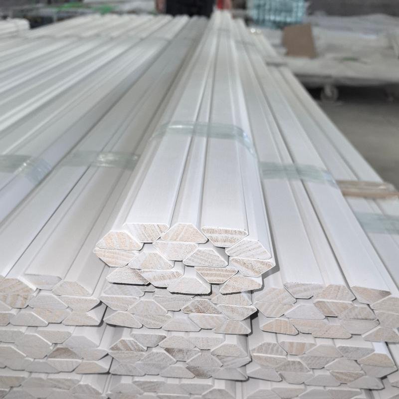 Quality control inspection of wood moulding profiles at Goodwood's Xiamen manufacturing facility