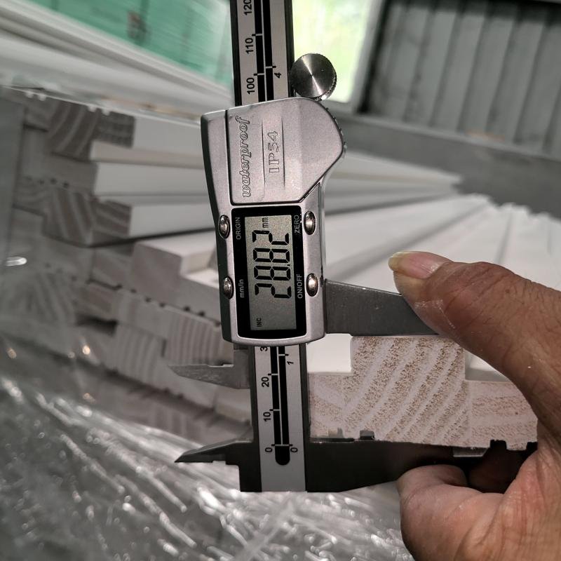 Quality control inspection checkpoint on Goodwood Mouldings' production floor in Xiamen, verifying moulding profiles against specification